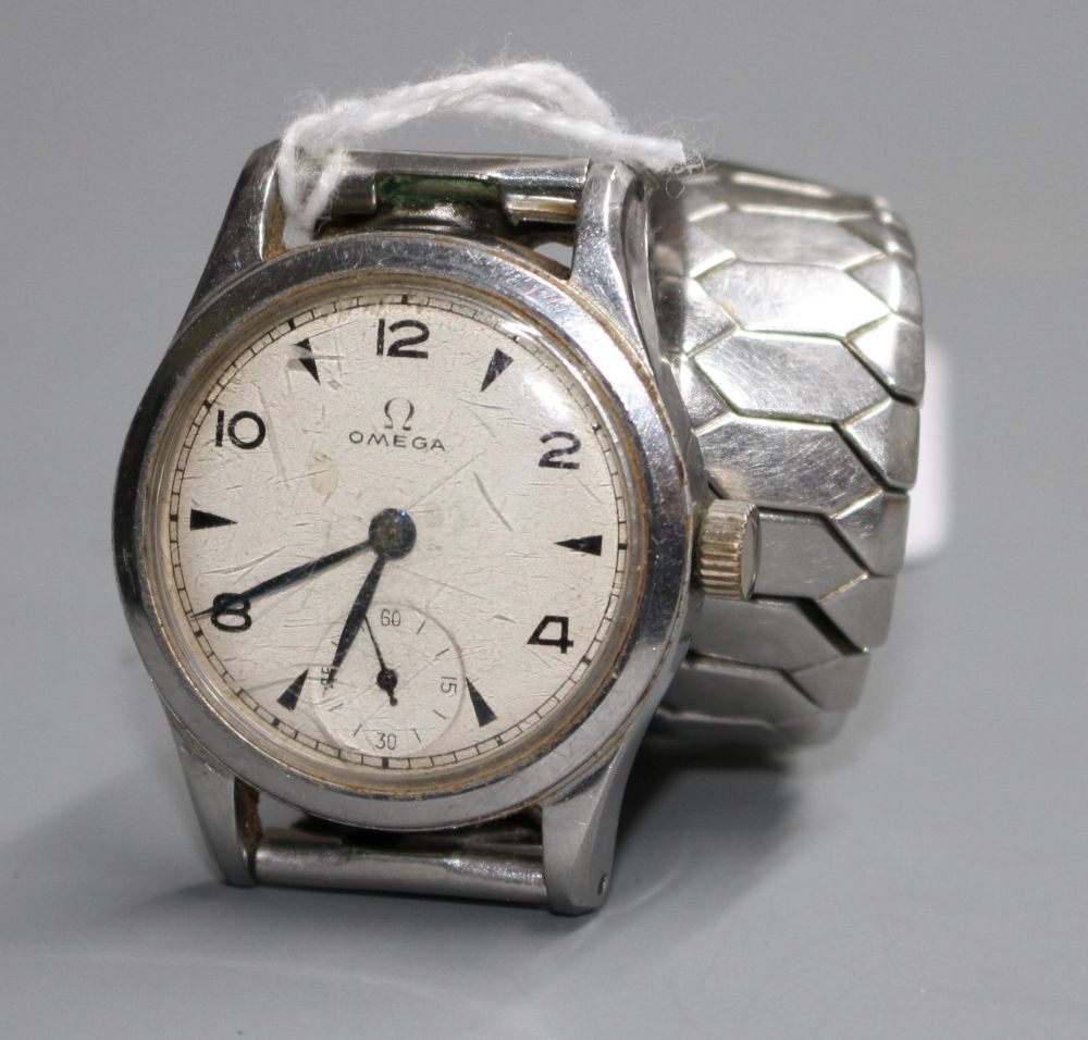 A gentlemans early 1940s stainless steel mid-size Omega manual wind wrist watch, on associated bracelet.